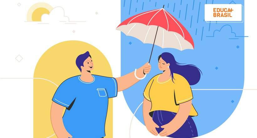 Homem estende guarda-chuva para uma mulher como ato de empatia.