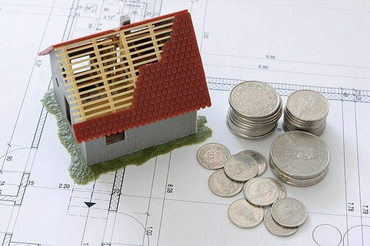 Representação de uma casa e moedas Representação de uma casa e moedas